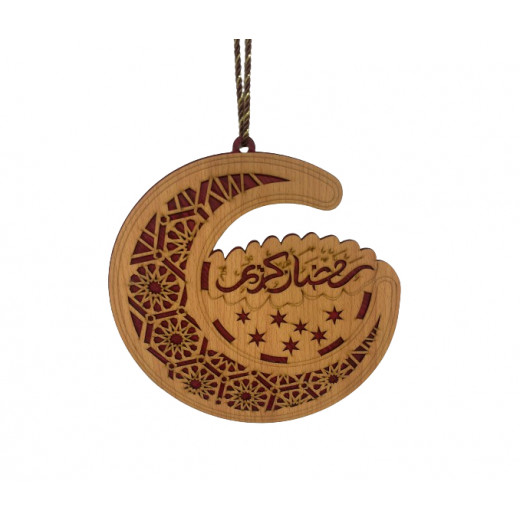 A wooden Ramadan Kareem pendant in the shape of a crescent